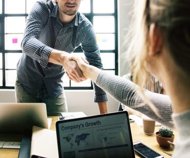 Business people shaking hands in agreement